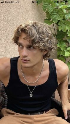 Top 50 Medium-Length Hairstyles for Men: Featuring Galleries and Videos | 50 of the Best Medium Hairstyles for Men (Gallery + Videos Included) Men Short Hair Curly, Mens Shaggy Haircut Wavy, Men's Wavy Haircut, Wavy Hair Flow Men, Wavy Perm Men Middle Part, How To Style The Flow Hairstyle Men, Long Hair Haircuts Men, Mens Short Wavy Hair, Long Wavy Haircuts Men