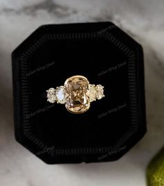 a fancy ring with three stones in it