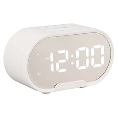 the alarm clock is white and has two numbers on each side, as well as an hour