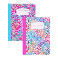 two notebooks with colorful flowers and leaves on the front one has a pink pen