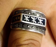 Une bague contient des lettres des berbères qui sont connues sous le nom (TIFINAGH), elles contiennent des couleurs vives et attrayantes qui donnent un aspect élégant à la main, elles sont fabriquées en argent 925, et parmi les accessoires qui montrent les anciens traditions des Amazigh (berbère marocains). A ring contains letters of the Berbers which are known as (TIFINAGH), they contain bright and attractive colors which give an elegant look to the hand, they are made of silver 925, and among the accessories which show the ancient traditions of the Amazigh (Berber Moroccans). Attractive Colors, 925 Ring, Ring For Men, The Hand, 925 Silver Rings, Vintage Accessories, Rings Statement, Silver 925, Morocco