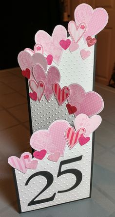 a valentine's day card with hearts on it and the number twenty five inside