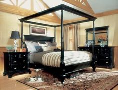 there is a four poster bed in the room