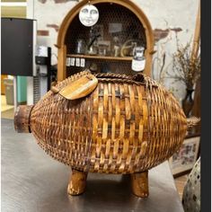 a wicker basket sitting on top of a table