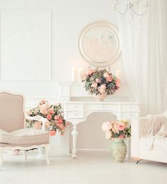 a living room filled with furniture and flowers