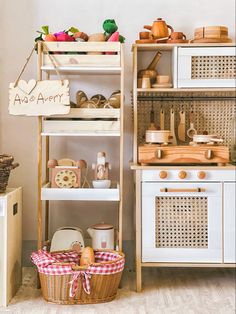 a kitchen with white cabinets and wooden shelves