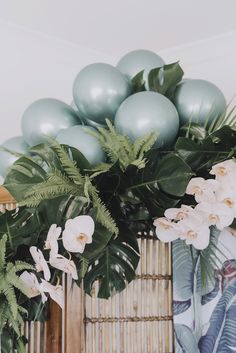 there are balloons and flowers on the table