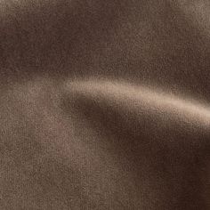 a close up view of a brown fabric textured with some sort of clothing material