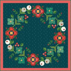 a quilted square with flowers and leaves in the shape of a circle on a blue background