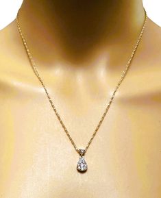 This pendant is just so beautiful!! I just love the teardrop design . And it's on a beautiful chain. It has 10 Brilliant cut diamonds the largest being approximately 2.5 mm. They are just bright and sparkly. It is on a very well-made 14k Yellow Gold Chain that is 18 inches long. The pendant itself is ..63 inches long and ..38 inches wide. The back of the pendant has some scratches due to wear but is otherwise in excellent condition. It is stamped with a Patent number and also "14k". The chain is Cluster Pendant, Yellow Gold Chain, Diamond Cluster, Brilliant Cut Diamond, So Beautiful, Gold Chain, Just Love, Diamond Jewelry, Choker Necklace