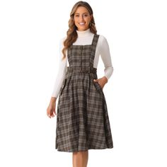 Allegra K's retro plaid dress is preppy and casual, ideal for women, ladies, or students. Featuring a flattering A-line silhouette, this overall suspender skirt suits various body types. The dress includes design elements such as a square neck, sleeveless cut, button front, high waist, belted waist, and side pockets. Perfect for casual daily wear, school days, cafe or tea time, office work, shopping, weekends, dating, street style, and graduation ceremonies. The dress is easy to pair with differ Retro Plaid Dress, Plaid Overall Dress, Vintage Suspenders, Flowy Midi Dress, Suspender Skirt, Puff Long Sleeves, Apron Dress, Midi Dress Casual, Suspender Dress