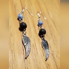 3½ Inch Long Angel Wing Charm Aromatherapy Earrings. These Beautiful Earrings Are Hand Crafted On Silver Tone Metal Findings With Black Lava Beads And Blue Glass Beads Finished With Silvertone Metal Angel Wing Charms. $12.00 +S&H #Countrygypsyor Diy Earrings Easy, Angel Earrings, Lava Beads, Lava Bead, Diy Earrings, Angel Wings, Blue Glass, Beautiful Earrings, Aromatherapy