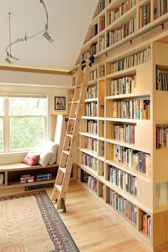 there is a ladder in front of the bookshelf