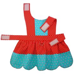 a red and blue polka dot dress with matching bib, headband and booties