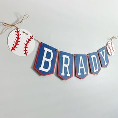 a baseball banner with the name brady hanging from it