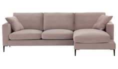 a beige couch with pillows on it