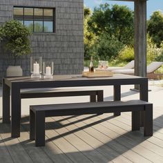 an outdoor table with two benches on it