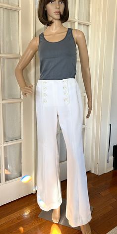 Cool Flares 1970s Broadfall Slacks, Small, Ribbed, Double Button, Hi-Rise, Bell Pants Sz 6 Hand made in the 70's, this sweet, ribbed pair of flares feature a double-button, flat front (once called a Broadfall style at the turn of the century). With a flared leg and front seam, or traveler's crease, this vintage pair of slacks will enhance the unique, vintage wardrobe. Measurements Waist: 28" around (some give - about 1-2 additional inches of comfortable stretch), Hip: 35"  Button rows: 6.5" long (4 buttons per row), Rise (crotch to top of waist): 10.5" Length: 40" Inseam: 30.5" Flare: 20" around at the knee, widening to 26" around at the hem. Condition: Excellent. No stains, tears or repairs. All original buttons. Very clean: stored in pet-free, smoke-free environment. Wardrobe Measurements, Bell Pants, Vintage Wardrobe, Turn Of The Century, Pantalon Large, Trousers Women, Capri Pants, 1970s, Bathing Beauties