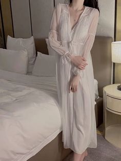 Silk Sleepwear Ensemble
Main fabric: 97.7% polyester fiber 2.3% spandex
Lining: 90% nylon, 10% spandex
Lace base fabric: 100% nylon
Water-soluble embroidery thread: 100% polyester fiber




Size/cm


Bust


Length


Waist


Fit weigh




M


79


110.5


72


40-55kg




L


83


110.5


76


50-60kg




XL


87


110.5


80


60-70kg








Robe Size/cm


Length


Bust


Shoulder


Fit weigh




One size/L


118


102


32


40-70kg





 	The above size is manually measured by “tiling-stretch Stretch V-neck Nightgown For Bedtime, White V-neck Nightgown For Pajama Party, White Long Sleeve Nightgown For Sleep, Long Sleeve White Nightgown For Sleep, White V-neck Robe For Sleep, Sheer V-neck Sleepwear For Sleepovers, Fitted Sheer Sleepwear For Loungewear, White V-neck Sleepwear For Sleepover, Fitted V-neck Robe For Sleep