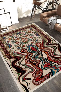 a large rug with an abstract design on the floor