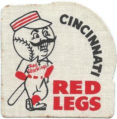 a red legs baseball patch with a cartoon character holding a bat in it's right hand