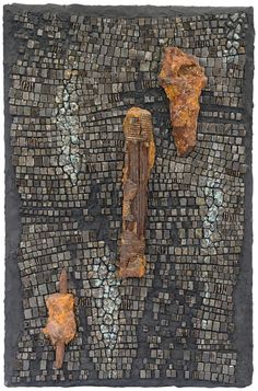 two rusted objects are on a mosaic tile background, one is broken and the other has fallen apart