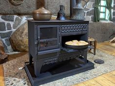 an old fashioned stove with some bread in it