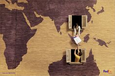 two people are looking out the window of a world map wallpapered in brown and purple