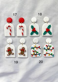 six christmas themed earrings with candy canes and gingerbread man on them, all decorated in different colors