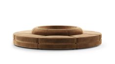 the circular couch is made out of sued