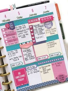 an open planner book with pink and blue pages