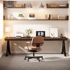 a desk with a chair and shelf above it in an office space that is well lit by the sunlight