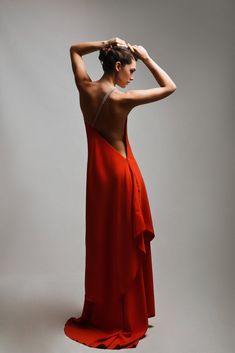 A mesmerizing red dress that embodies both allure and sophistication, showcasing a daring open-back design that adds a touch of sensuality. The focal point of this stunning ensemble is a meticulously crafted belt, adorned with hand-sewn stones, accentuating the shoulder and the back with a dazzling display of shimmer. The rich red hue of the dress exudes confidence and passion, while the intricately embellished belt elevates the glamour quotient. Together, the open back and the bedazzled belt cr Red Sleeveless Backless Dress, Red Sleeveless Backless Dress With Back Opening, Maxi Dress With Closed Back For Evening, Maxi Dress With Back Opening For Evening, Glamorous Backless Evening Dress With Sheer Back, Elegant Red Carpet Dress With Back Opening, Party Maxi Dress With Back Opening, Elegant Red Evening Dress With Back Opening, Red Backless Evening Dress With Back Opening