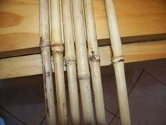 a bunch of bamboo sticks sitting on top of a wooden table