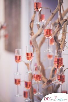 several wine glasses are arranged in a tree