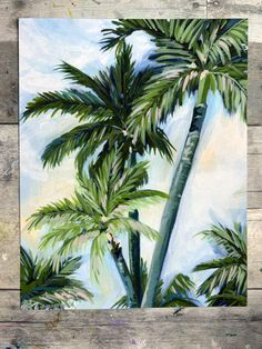 a painting of palm trees on a wooden wall