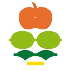 an orange and green pumpkin sitting on top of a pair of glasses with the word