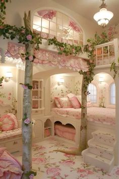 a bedroom with pink flowers on the walls and white stairs leading up to two beds