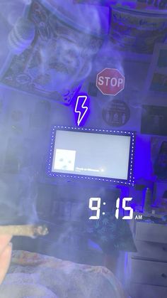 there is a clock displayed on the wall next to a window with blue light coming through it