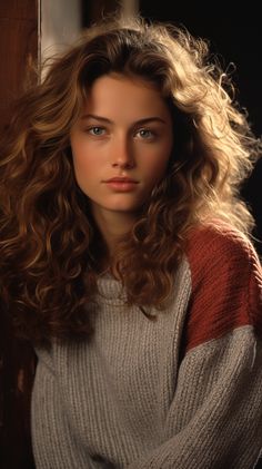 a beautiful young woman with long curly hair