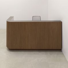 an empty reception counter in a white walled room