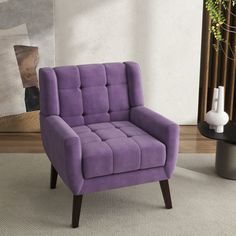 a purple chair sitting on top of a carpeted floor