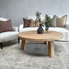 a living room with two couches and a coffee table in front of the couch