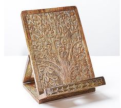 a wooden stand with an intricate design on it