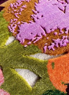 a close up of a rug with flowers on it