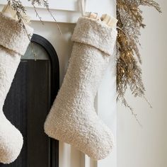 Our Boucle Stockings bring seasonal charm to a mantel or stair rail. The neutral, simple design adds beauty to the holidays, and don't worry: they're roomy enough to stash plenty of presents. KEY DETAILS 12"w x 18"h. 100% polyester shell. Sold individually. Made in China. Christmas Mantel Stocking Ideas, Modern Christmas Stockings Ideas, Neutral Stockings Christmas, Sherpa Stocking, Hosting Era, Beige Mom, Boho Christmas Stocking, Modern Christmas Stocking, Velvet Christmas Stocking