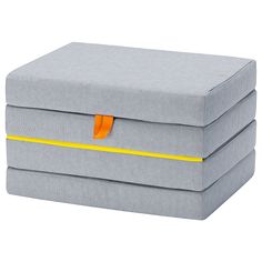 two grey boxes with yellow handles on each one and an orange ribbon around the top