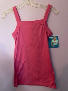 Vintage 1980's pink stretch knit (poly/cotton) tank top mage by Wrangler Juniors. Poly/cotton  Size Small, measurements are (unstretched, flat) 30" chest (up to 34-36) 24" top of shoulder to bottom hem. Pink Fitted Tank Vest, Fitted Sleeveless 90s Tops, 90s Style Stretch Tank Top For Spring, Pink Sleeveless Cotton Vest, 90s Style Stretch Cotton Tank Top, Pink Cotton Tank Vest, Pink Cotton Sleeveless Tank Top, 90s Pink Sleeveless Top, Pink Stretch Sleeveless Top