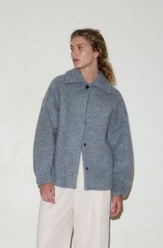 the boiled wool coat by Deiji Studios in blue grey an oversized warming coat in a longline boxy fit features deep front pockets with curved seams, pleated details at cuff, press stud front closure with top button, dropped back yoke and dropped shoulders, in a mid-weight boiled sustainable wool blend and lined with light cotton. made from a sustainable blend of 59% organic cotton and 41% RWS wool   worn here with the gathered pocket pant in off white also available in black Grey Coat Outfit Winter, Grey Coat Outfit, Boiled Wool Coat, White Wool Coat, Deiji Studios, Winter Coat Outfits, Gray Wool Coat, Grey Coat