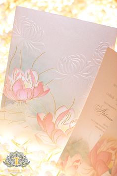 two wedding cards with pink flowers on them